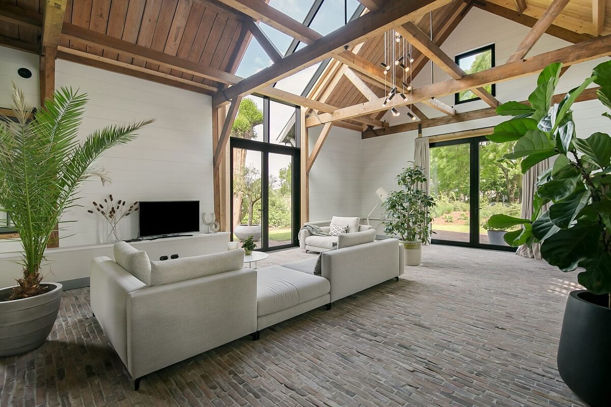 A Dutch Barn House with Brick Floors and Wooden Ceilings 3 living-room-white-sofa-wooden-ceiling-skylight-nordroom