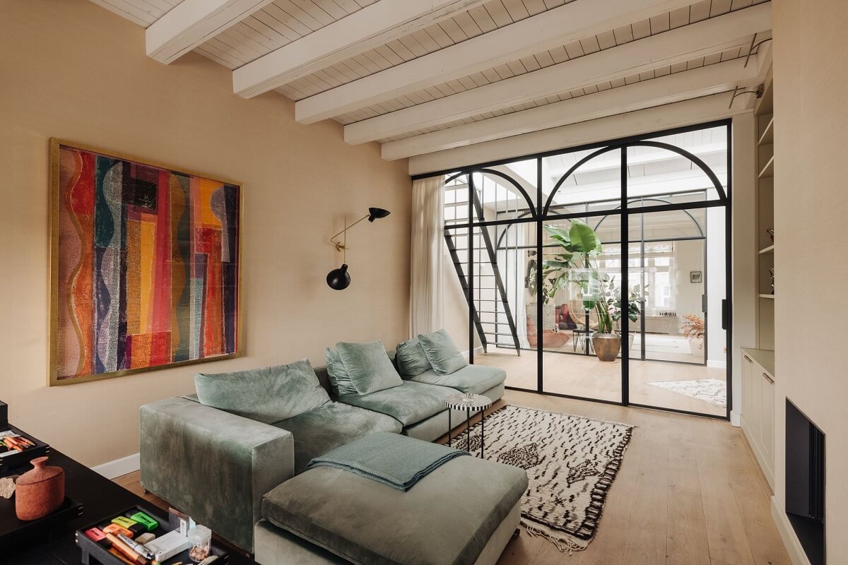 A Grand Renovated Family Home in Amsterdam 23 lounge-room-steel-framed-glass-doors-nordroom