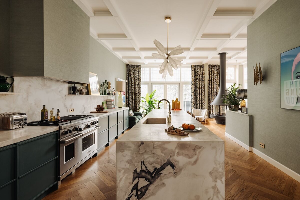 A Grand Renovated Family Home in Amsterdam 2 marble-kitchen-island-blue-cupboards-nordroom
