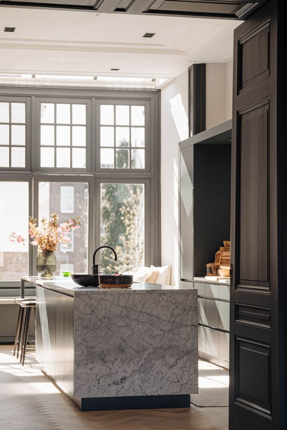 A Monochrome Duplex Apartment in Amsterdam 6 marble-kitchen-island-modern-monochrome-kitchen-nordroom