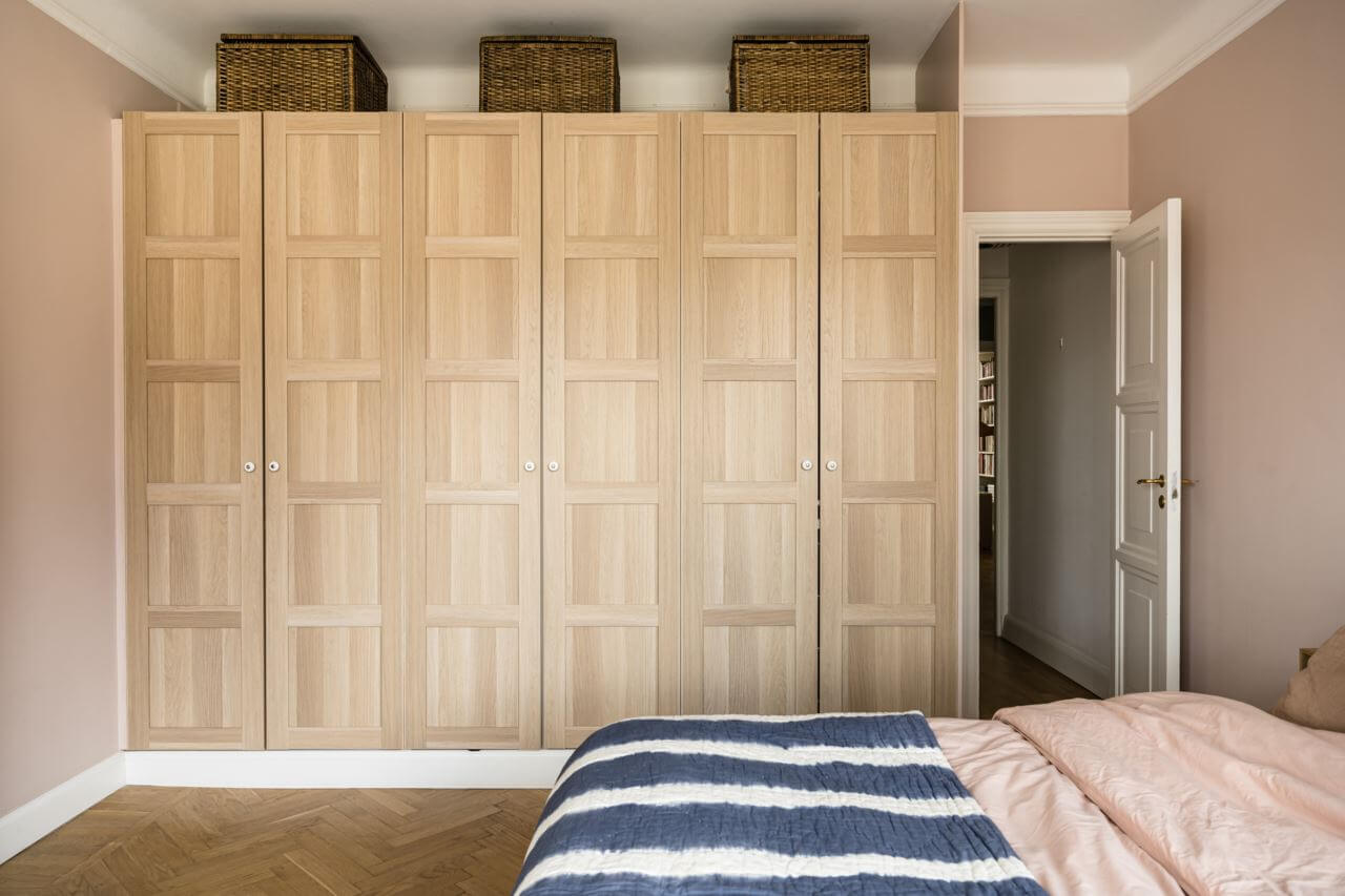 Green Color Accents in a Beautiful Historic Apartment 17 master-bedroom-built-in-wardrobes-striped-throw-nordroom