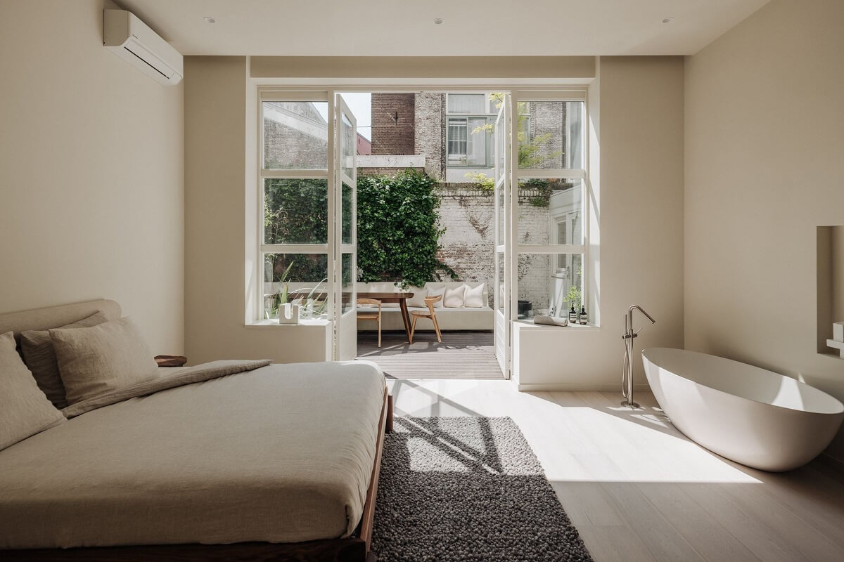 A Modern Home in a Historic Amsterdam Canal House 9 master-bedroom-with-freestanding-bath-and-terrace-nordroom
