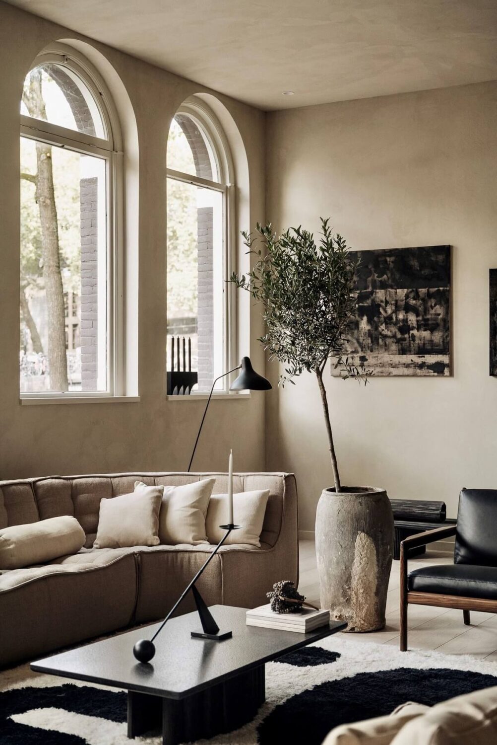 A Modern Home in a Historic Amsterdam Canal House 2 modern-light-gray-living-room-arched-windows-nordroom