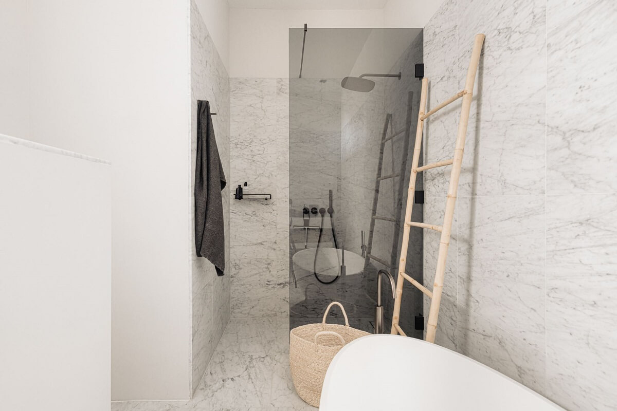 A Monochrome Duplex Apartment in Amsterdam 18 modern-marble-bathroom-walk-in-shower-nordroom