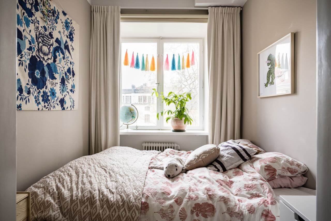 Green Color Accents in a Beautiful Historic Apartment 23 narrow-bedroom-blue-artwork-nordroom