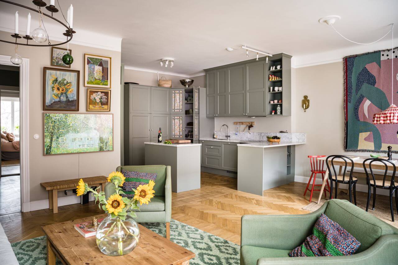 Green Color Accents in a Beautiful Historic Apartment 6 open-plan-kitchen-living-room-artwork-nordroom