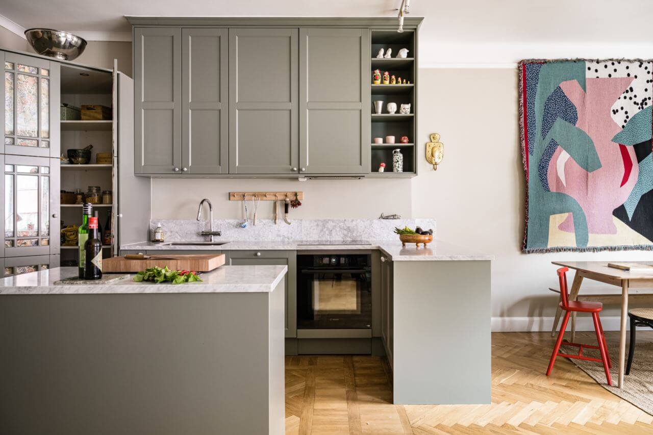 Green Color Accents in a Beautiful Historic Apartment 9 open-plan-kitchen-pantry-wooden-floor-nordroom