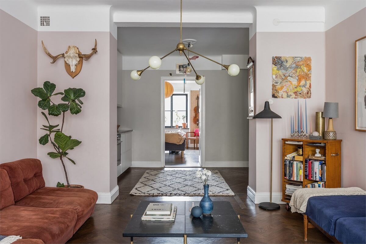 A Warm Scandinavian Apartment Filled with Books & Plants 6 open-plan-living-room-kitchen-dark-wooden-herringbone-floor-nordroom
