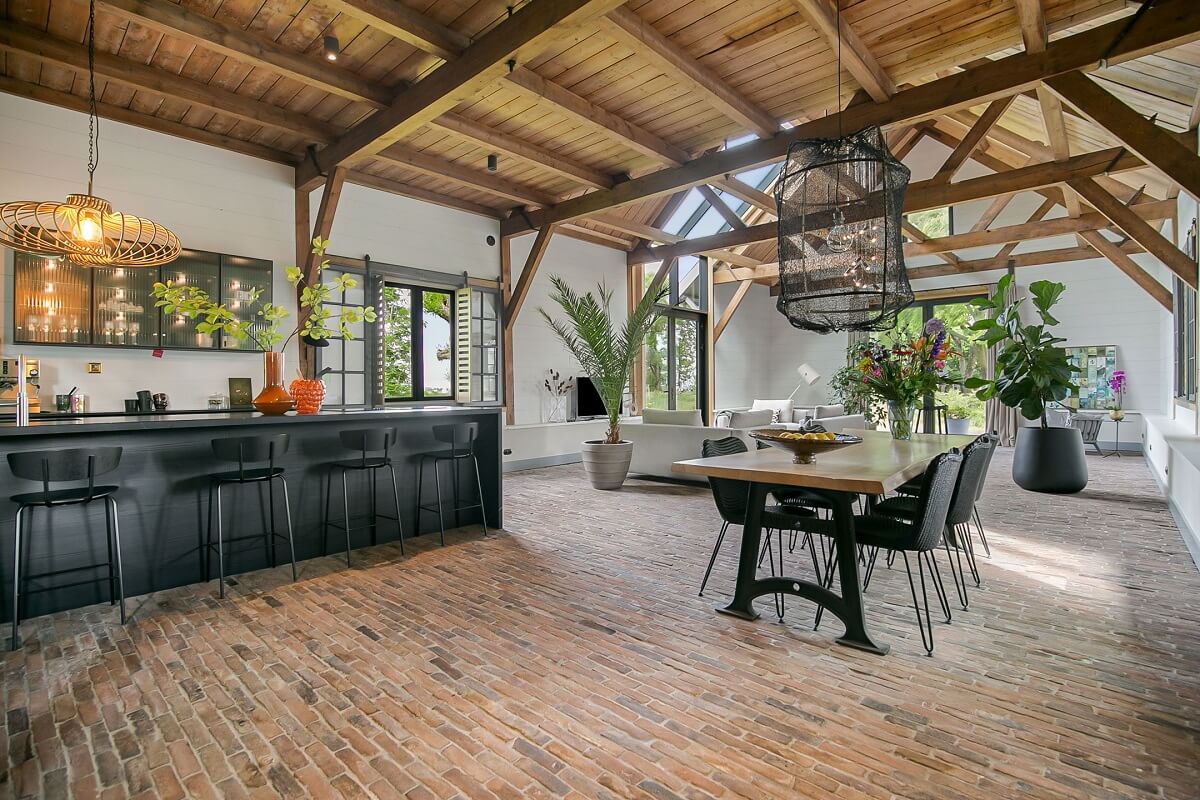 A Dutch Barn House with Brick Floors and Wooden Ceilings 6 open-plan-living-space-brick-floor-island-nordroom