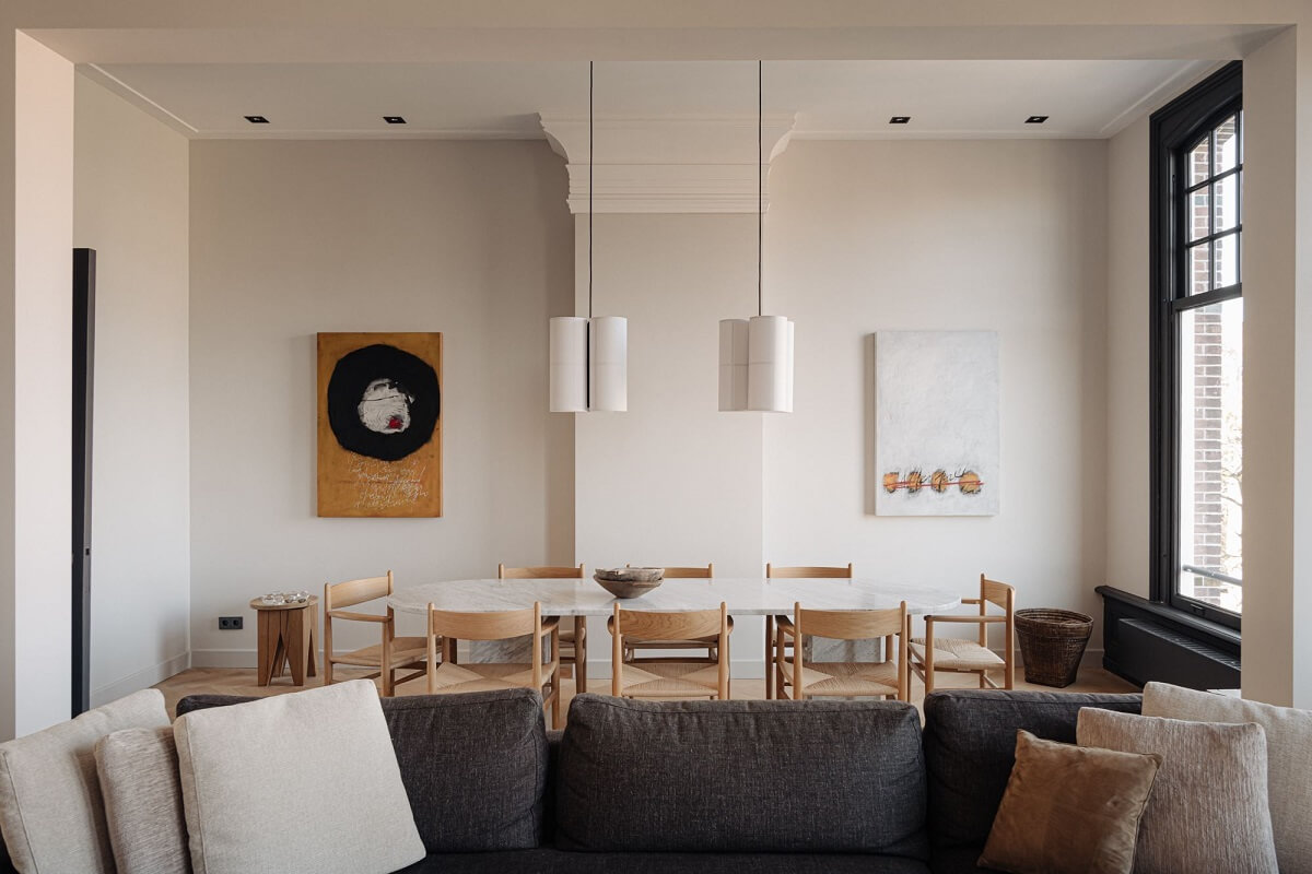 A Monochrome Duplex Apartment in Amsterdam 2 open-plan-living-space-with-large-dining-table-nordroom