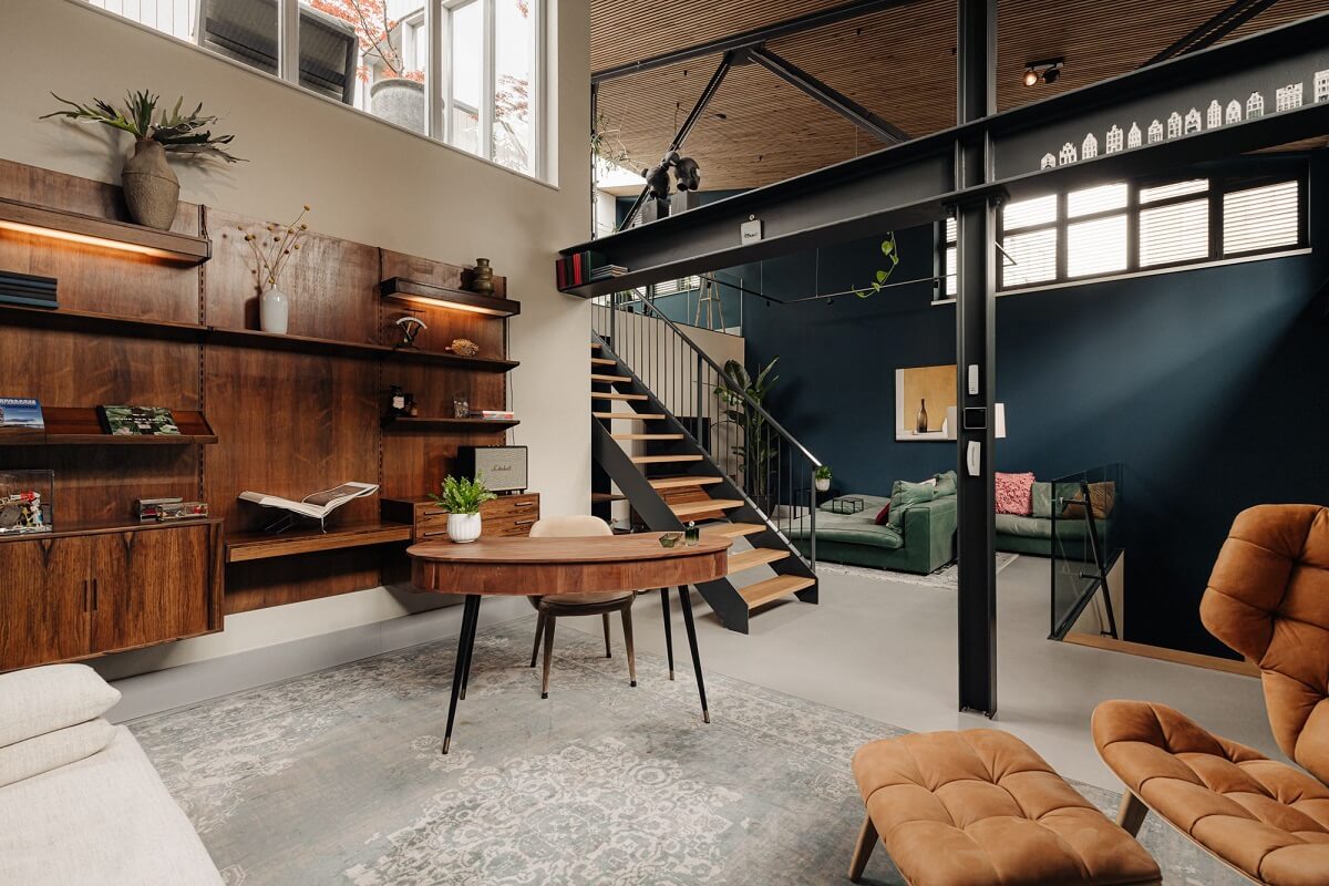 An Industrial Loft Home in Amsterdam 5 open-plan-loft-apartment-high-ceilings-blue-wall-nordroom