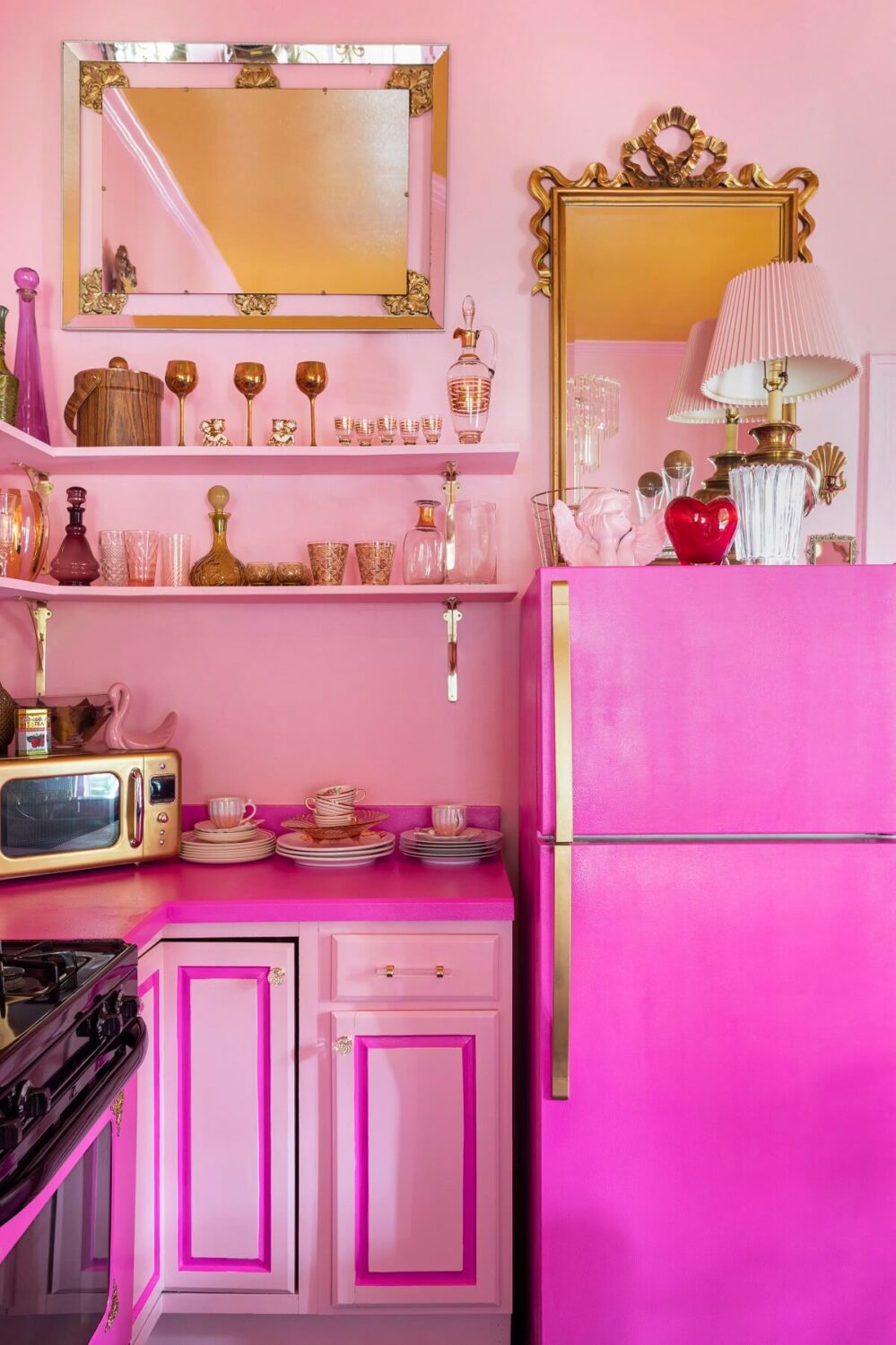 Barbiecore Interiors: The New Colorful & Fun Design Trend 11 pink-fridge-kitchen-cabinets-shelves-nordroom
