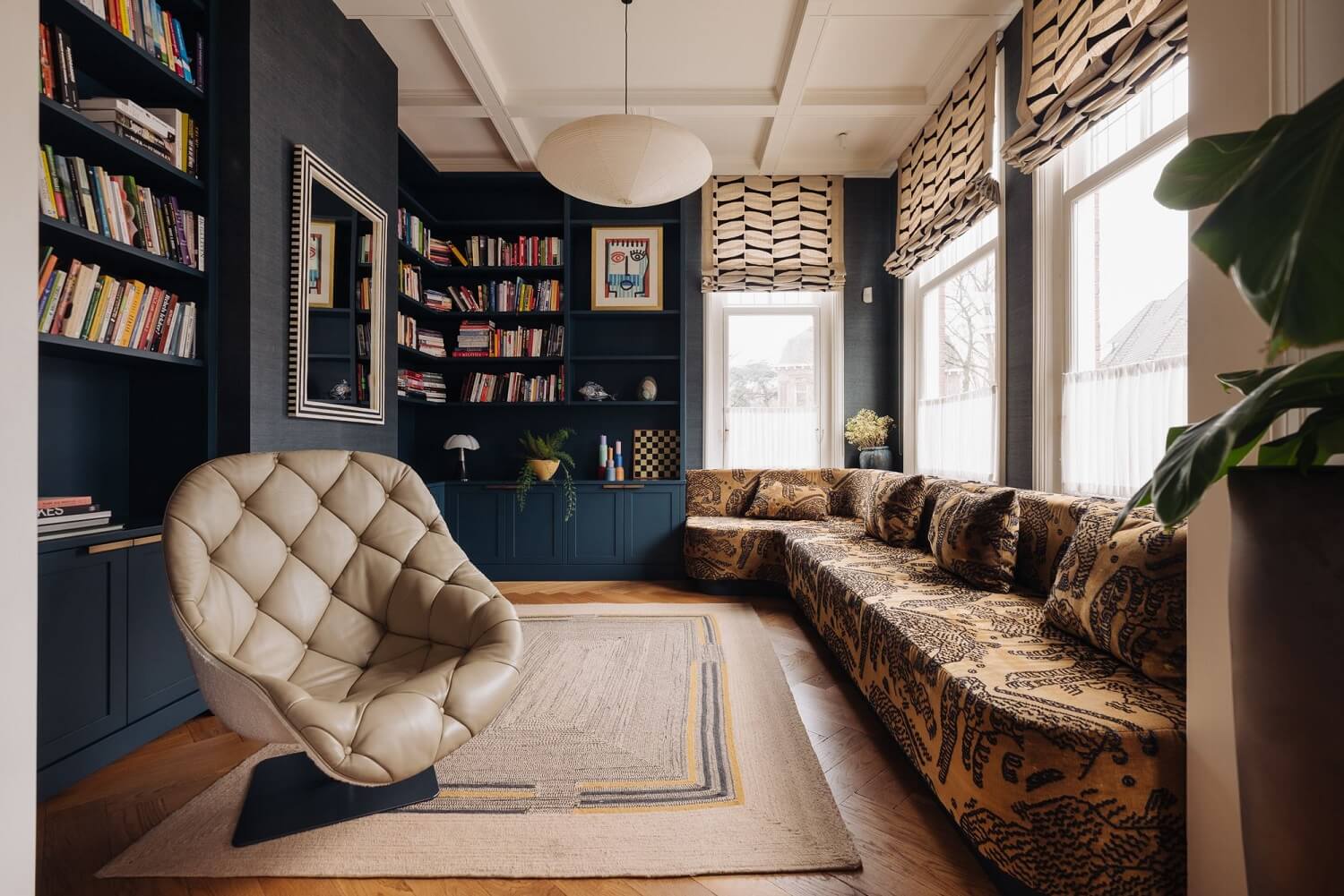 A Grand Renovated Family Home in Amsterdam 9 reading-room-blue-bookcases-built-in-couch-mix-match-textures-patterns-nordroom