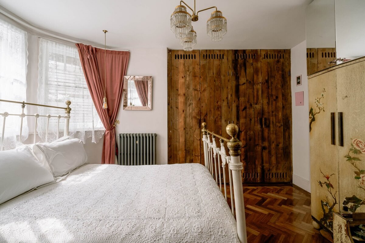 A London Home with Color Accents and a Secret Garden Shed 11 rustic-bedroom-wooden-floor-wardrobe-doors-nordroom