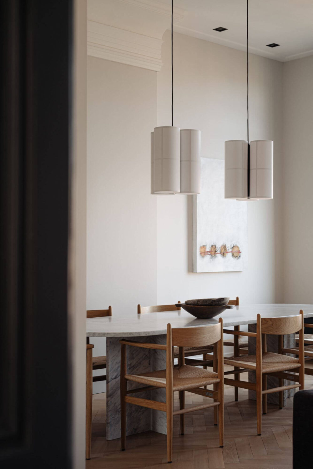 A Monochrome Duplex Apartment in Amsterdam 3 scandinavian-design-dining-table-pendants-nordroom