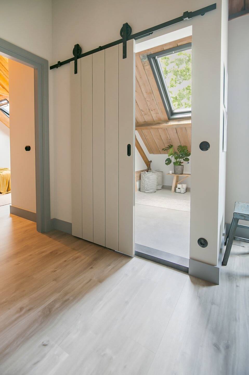 A Dutch Barn House with Brick Floors and Wooden Ceilings 17 sliding-barn-door-bathroom-nordroom