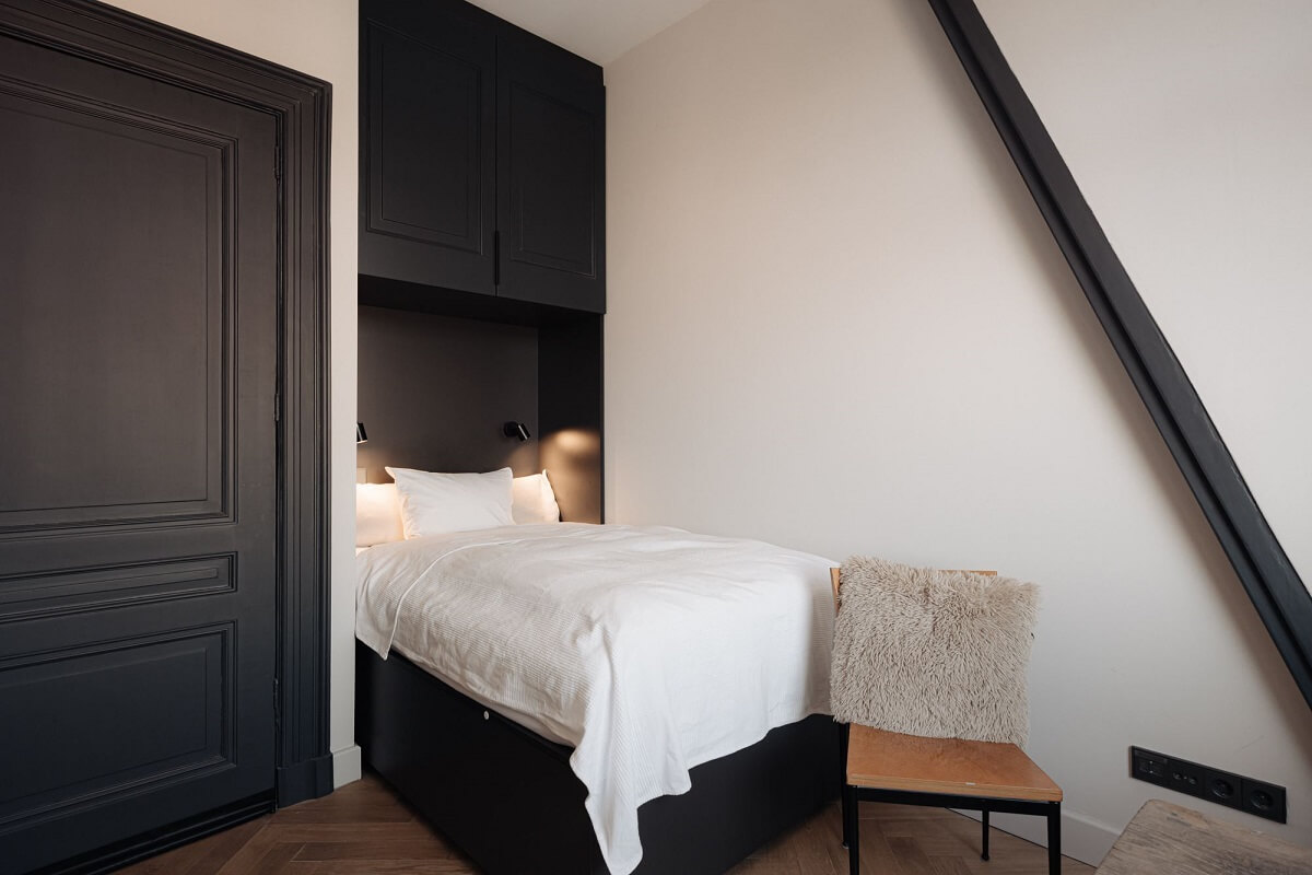 A Monochrome Duplex Apartment in Amsterdam 19 small-bedroom-bed-nook-built-in-storage-nordroom
