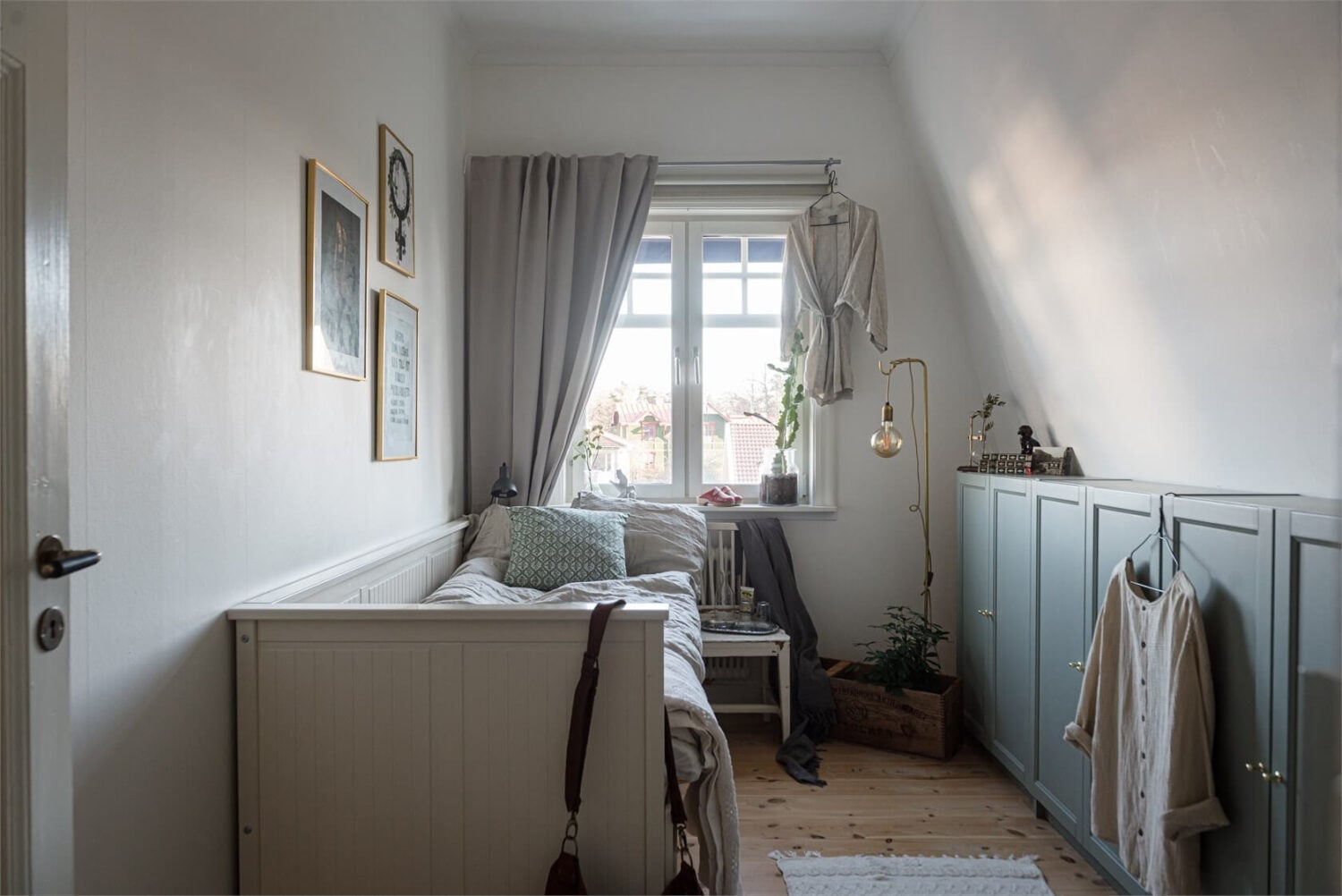 Natural Light in a Family Home in Sweden 17 small-bedroom-slanted-ceiling-sofa-bed-nordroom