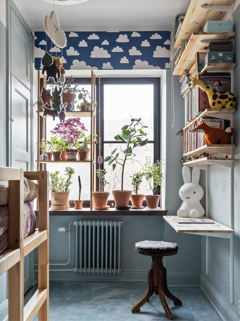 A Warm Scandinavian Apartment Filled with Books & Plants 14 small-blue-kids-bedroom-desk-bookshelves-bunk-bed-nordroom