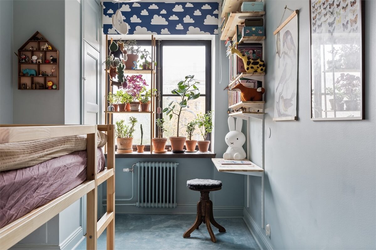 A Warm Scandinavian Apartment Filled with Books & Plants 13 small-kids-bedroom-plants-desk-bookshelves-bunk-bed-nordroom