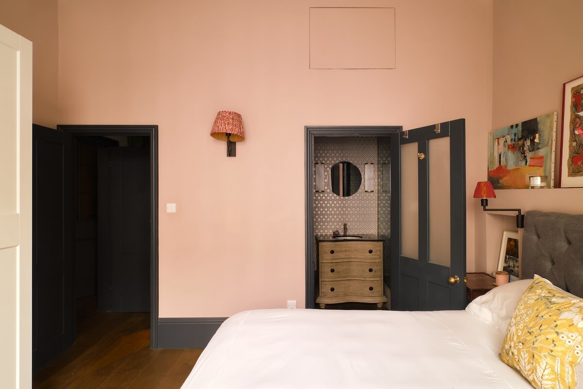 Bold Colors and Light Rooms in a Historic Apartment 13 soft-pink-bedroom-en-suite-bathroom-nordroom