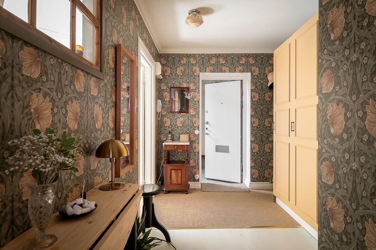 A Bright Swedish Apartment with William Morris Wallpaper 18 spacious-hallway-william-morris-wallpaper-yellow-closets-nordroom