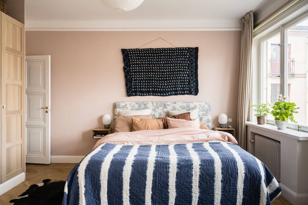 Green Color Accents in a Beautiful Historic Apartment 16 striped-throw-master-bedroom-nordroom