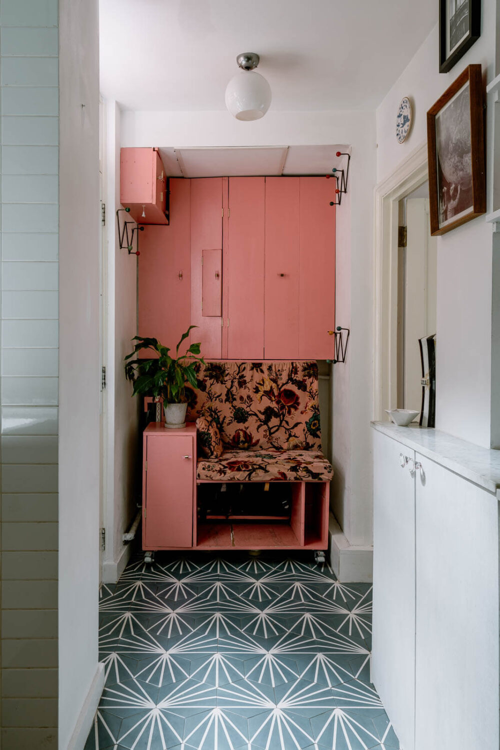 A London Home with Color Accents and a Secret Garden Shed 7 teal-floor-tiles-pink-cabinets-bench-hallway-nordroom