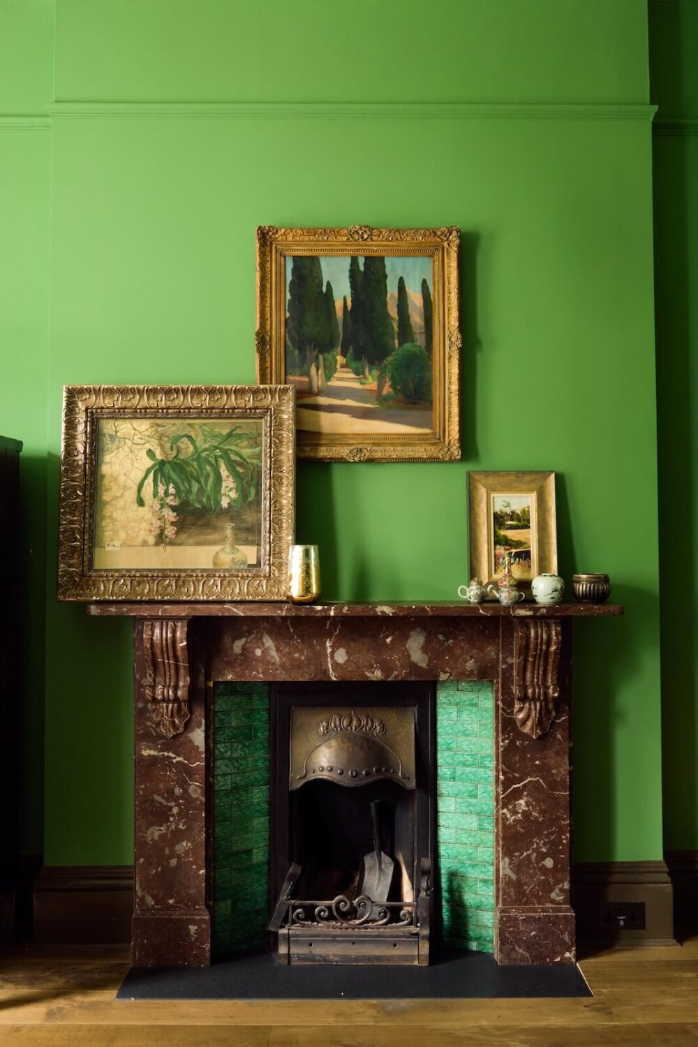Bold Colors and Light Rooms in a Historic Apartment 3 violet-marble-firpelace-green-walls-antique-art-nordroom