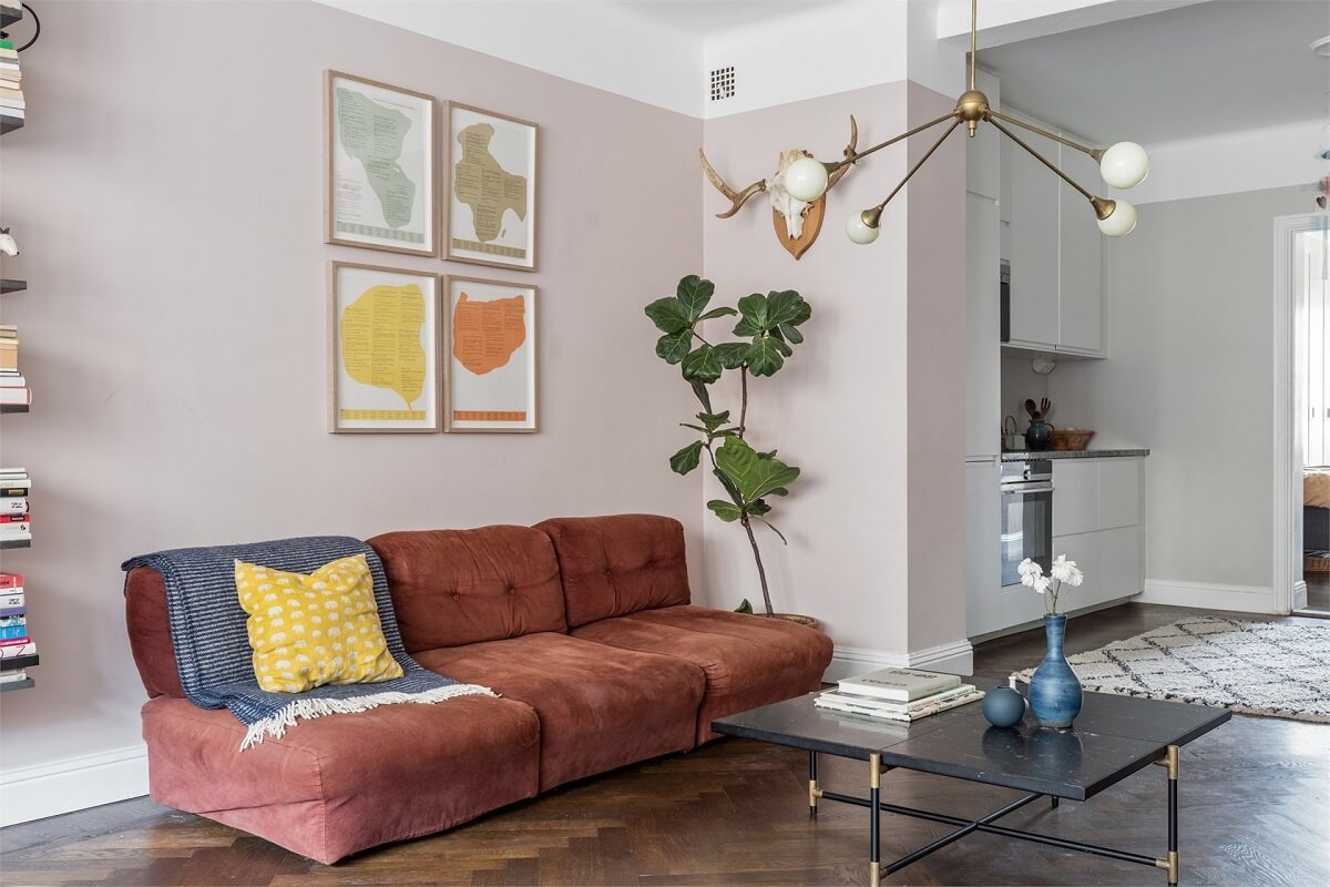 A Warm Scandinavian Apartment Filled with Books & Plants 3 warm-red-sofa-open-plan-living-room-kitchen-nordroom