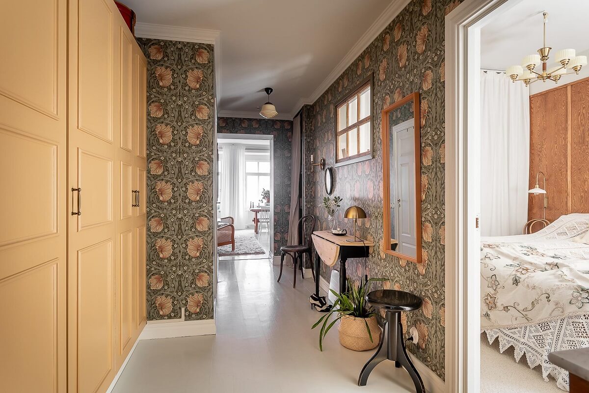 A Bright Swedish Apartment with William Morris Wallpaper 12 william-morris-wallpaper-hallway-yellow-wardrobes-nordroom