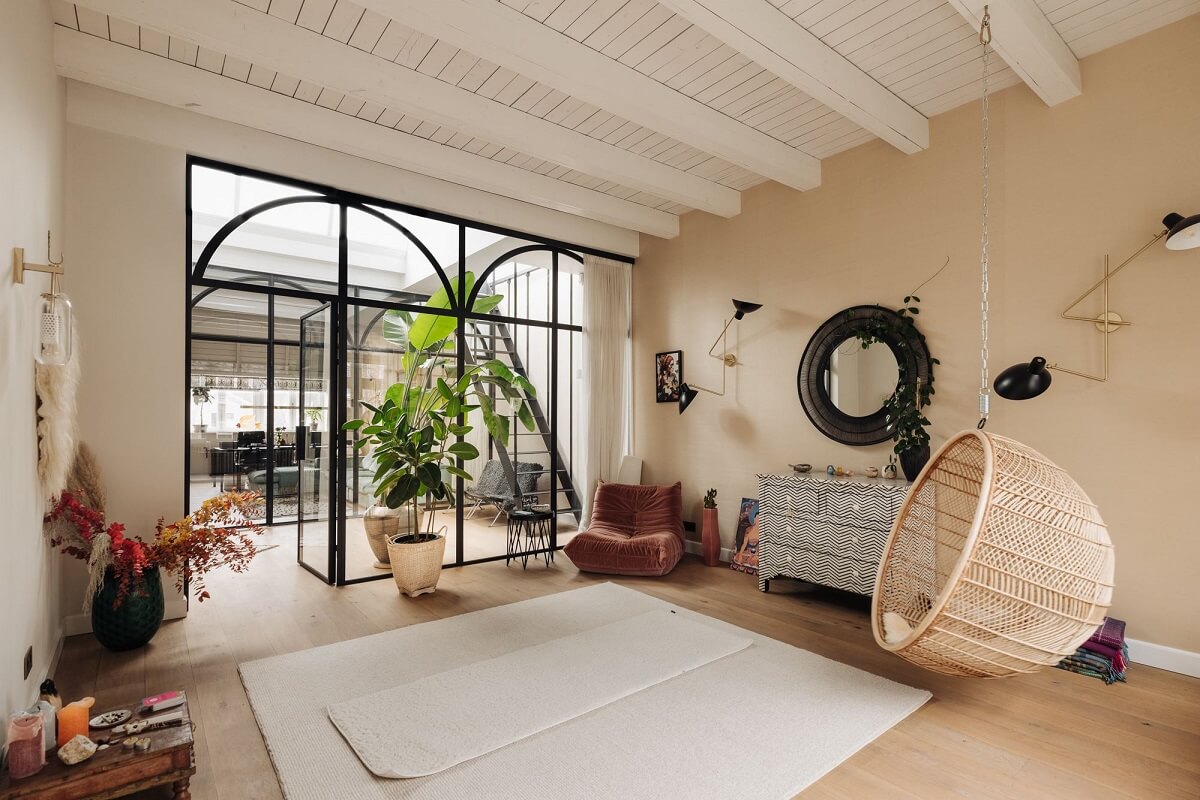 A Grand Renovated Family Home in Amsterdam 24 yoga-room-steel-framed-glass-doors-nordroom