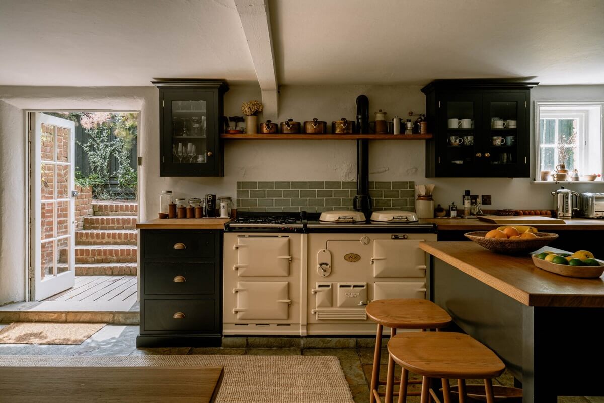A Warm Living Room in a Historic English Home 10 aga-cooker-stone-floor-dark-blue-devol-kitchen-nordroom