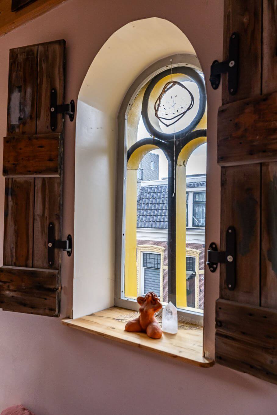 A Colorful Church Conversion in The Netherlands 23 arched-stained-glass-window-church-conversion-nordroom