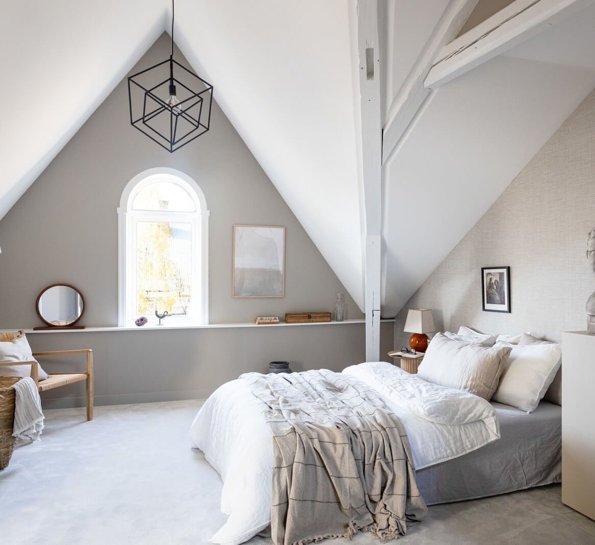 A Bright Penthouse Apartment in Oslo 11 attic-bedroom-slanted-ceiling-exposed-beams-nordroom