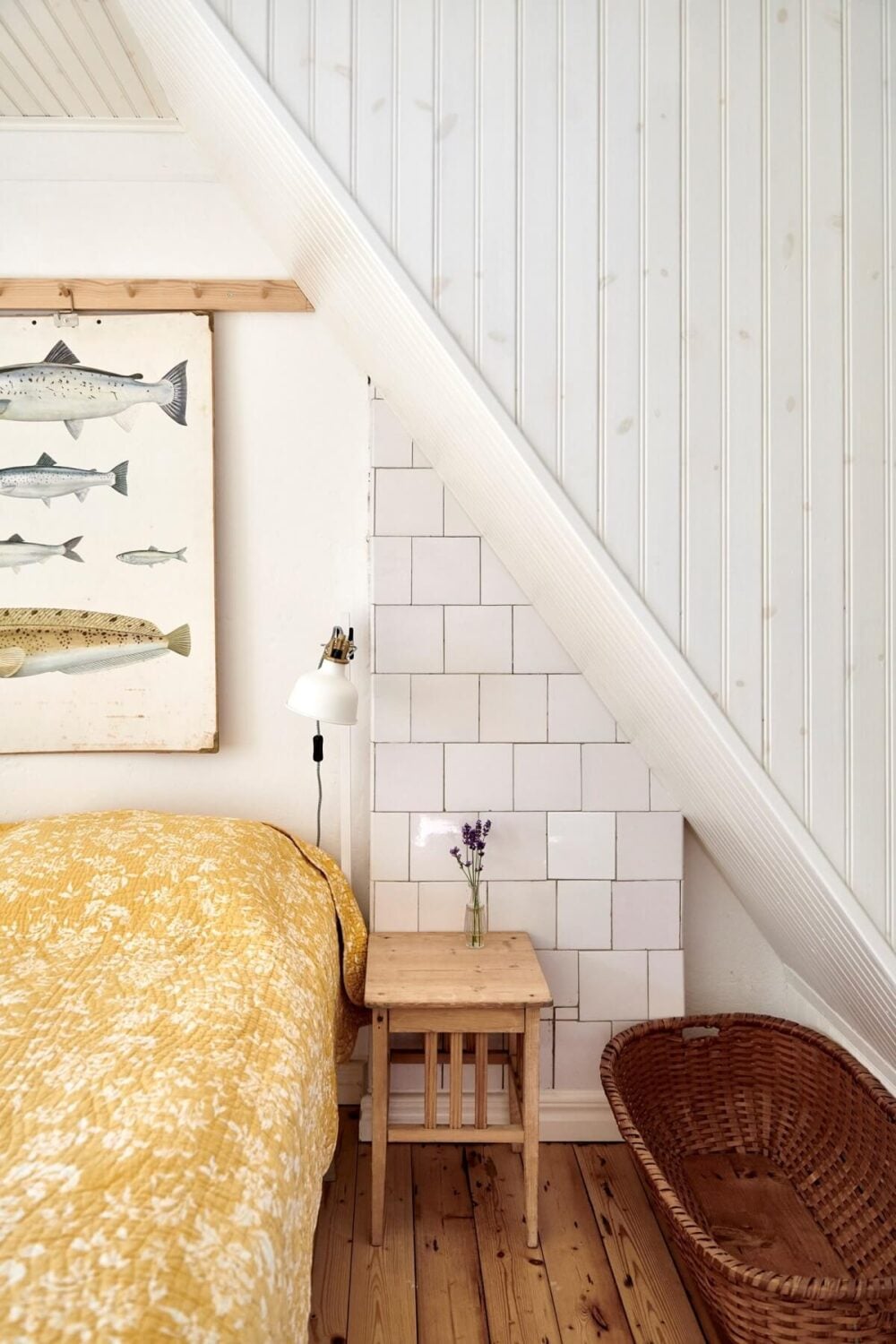 Natural Light in a Charming Swedish Country House 17 attic-bedroom-wooden-floor-slanted-ceiling-nordroom