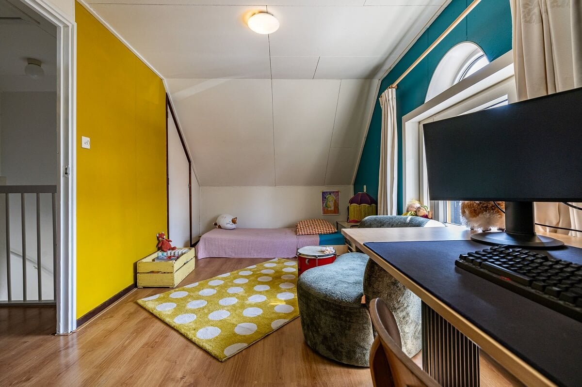 A Colorful Church Conversion in The Netherlands 28 attic-bedroom-yellow-blue-walls-nordroom
