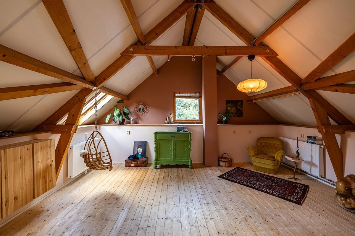 A Colorful Church Conversion in The Netherlands 27 attic-room-exposed-wooden-beams-nordroom