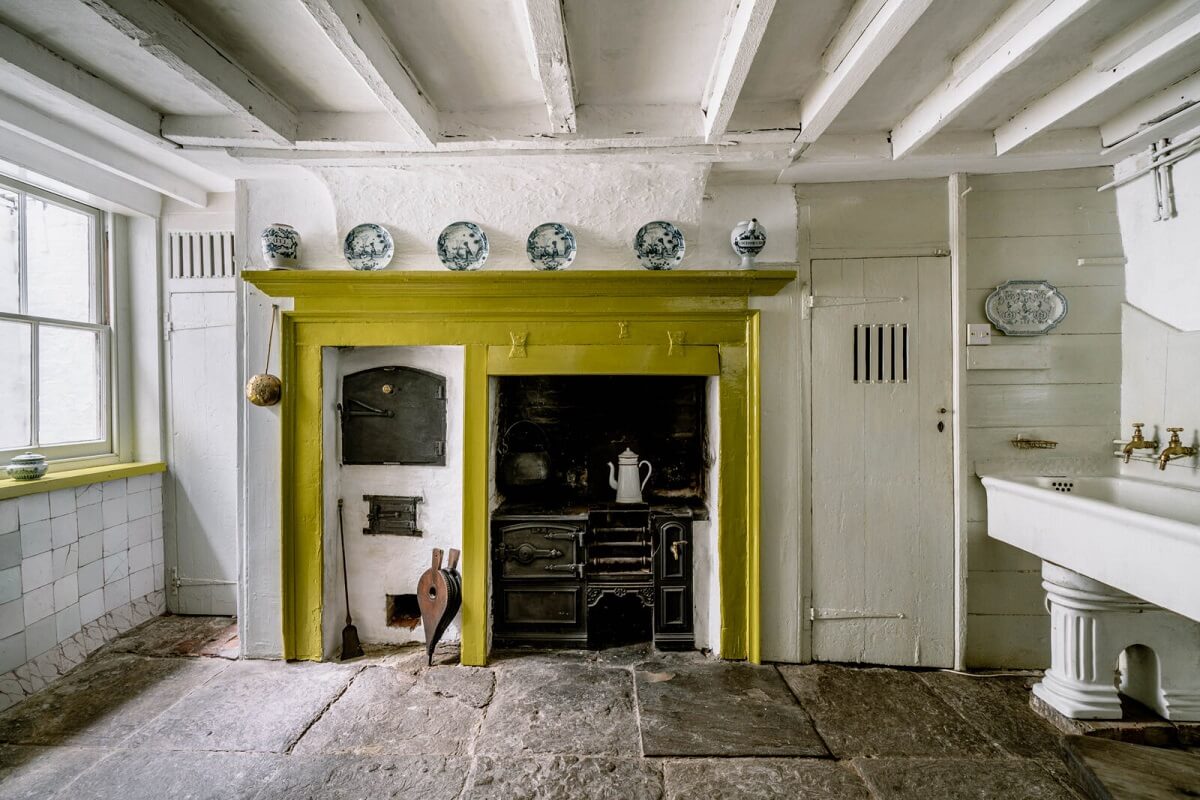 A Unique Historic House Near the English Coast 13 basement-kitchen-yellow-accent-stove-nordroom