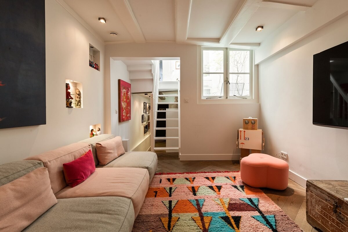 A Family Home in a Historic Canal House 20 basement-living-room-colorful-rug-nordroom