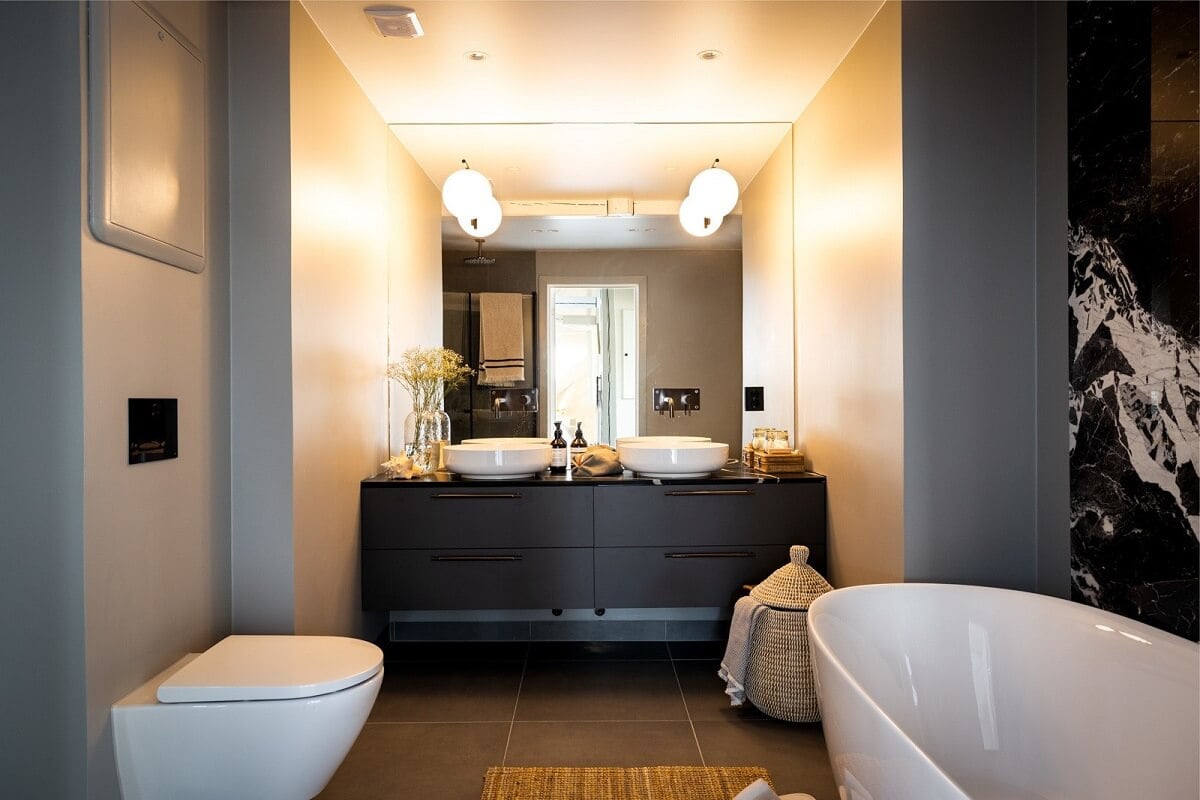 A Bright Penthouse Apartment in Oslo 18 bathroom-black-vanity-freestanding-bath-nordroom