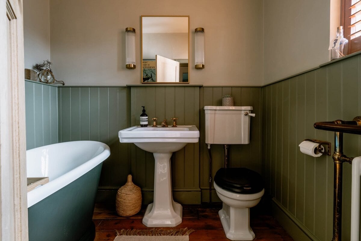 A Warm Living Room in a Historic English Home 20 bathroom-green-tongue-and-groove-paneling-nordroom