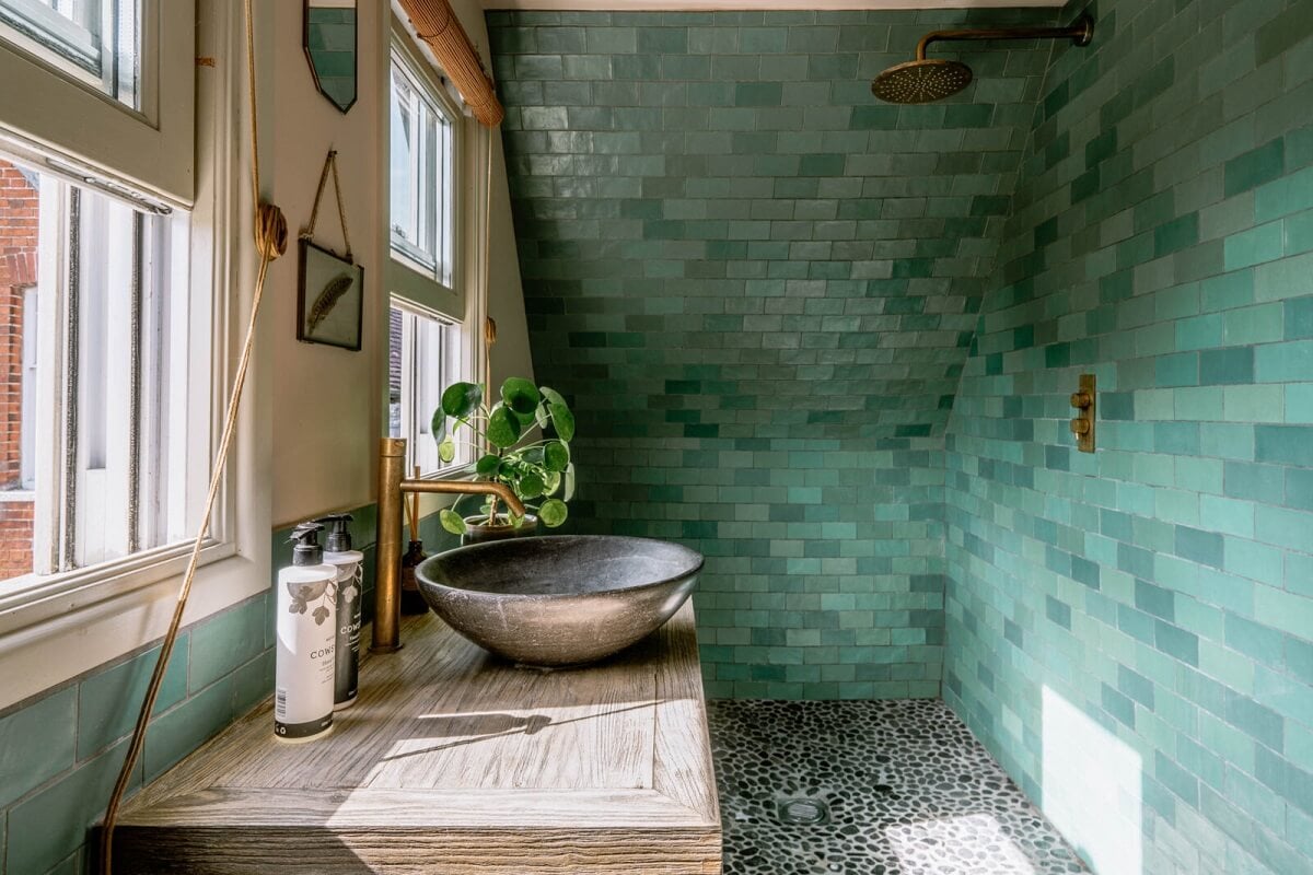 A Warm Living Room in a Historic English Home 23 bathroom-shower-blue-tiles-slanted-ceiling-nordroom