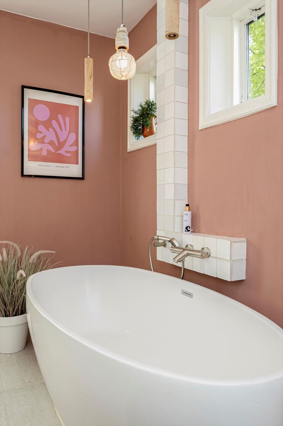 A Colorful School Conversion in The Netherlands 14 bathroom-terracotta-pink-tiles-freestanding-bath-nordroom