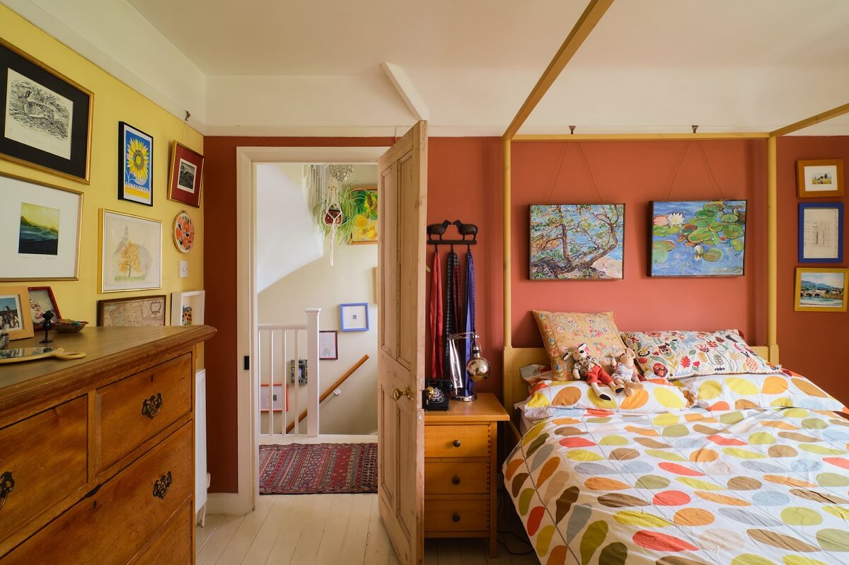 An English Cottage with Blue Color Accents 12 bedroom-canopy-bed-yellow-earthy-orange-walls-nordroom