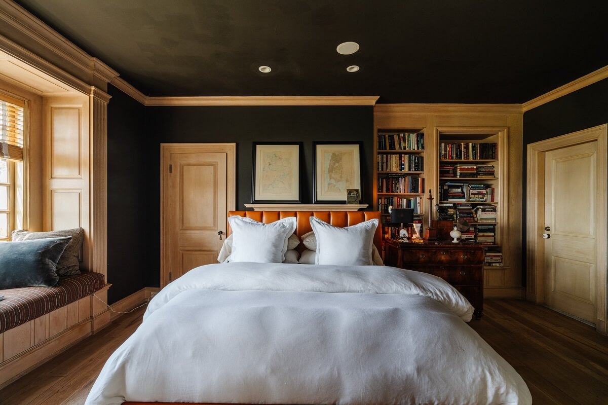 Black Accents in a Traditional Los Angeles Home 21 bedroom-leather-headboard-black-ceiling-window-seat-nordroom