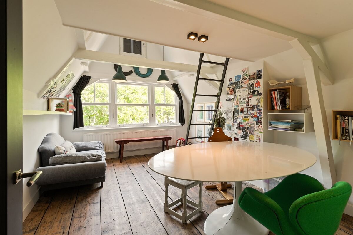 A Family Home in a Historic Canal House 23 bedroom-loft-bed-round-table-slanted-ceiling