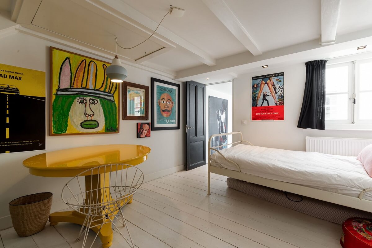 A Family Home in a Historic Canal House 21 bedroom-low-ceiling-white-floorboards-yellow-table-nordroom