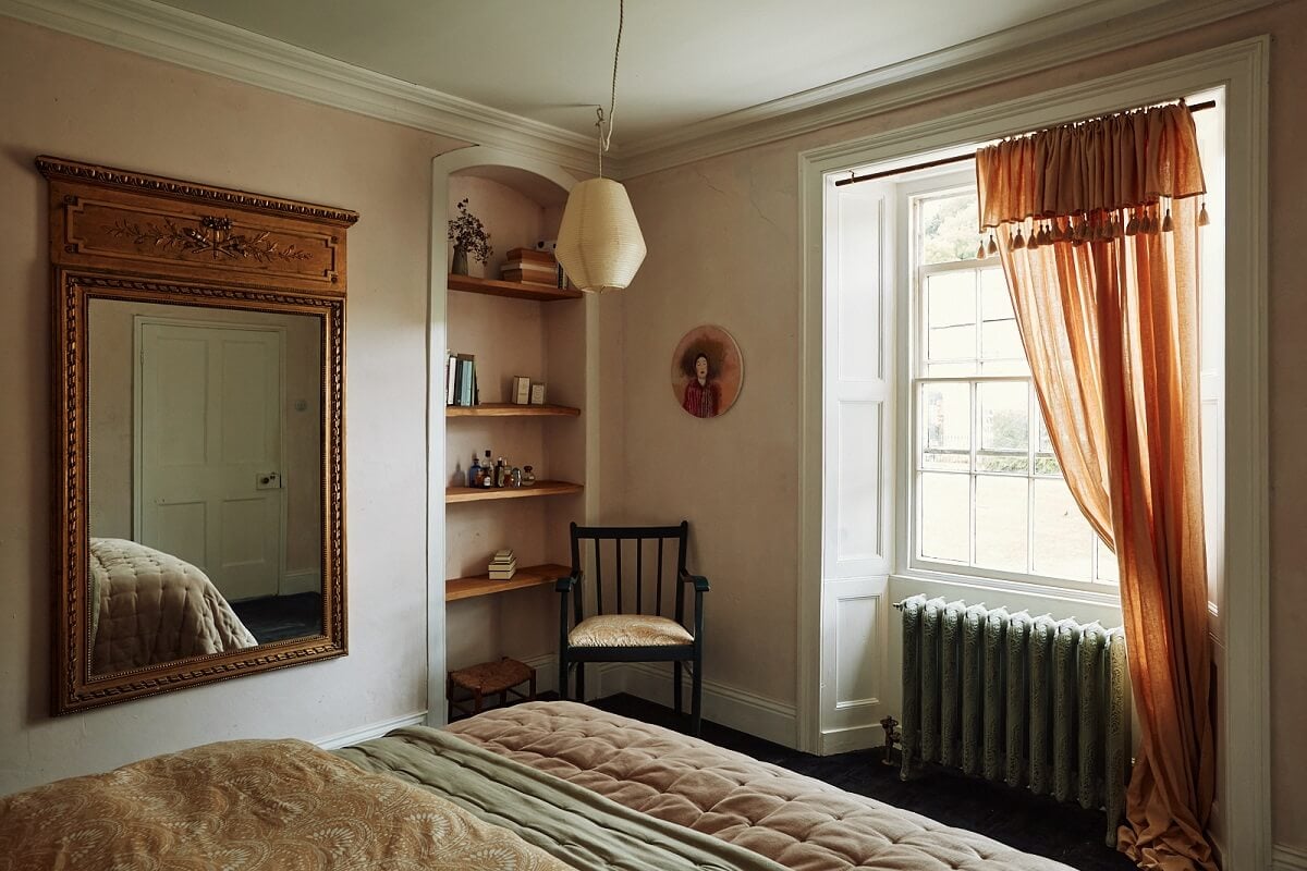 An English Cottage with a Perfect Kitchen 18 bedroom-plaster-walls-terracotta-curtain-large-mirror-built-in-shelves-nordroom