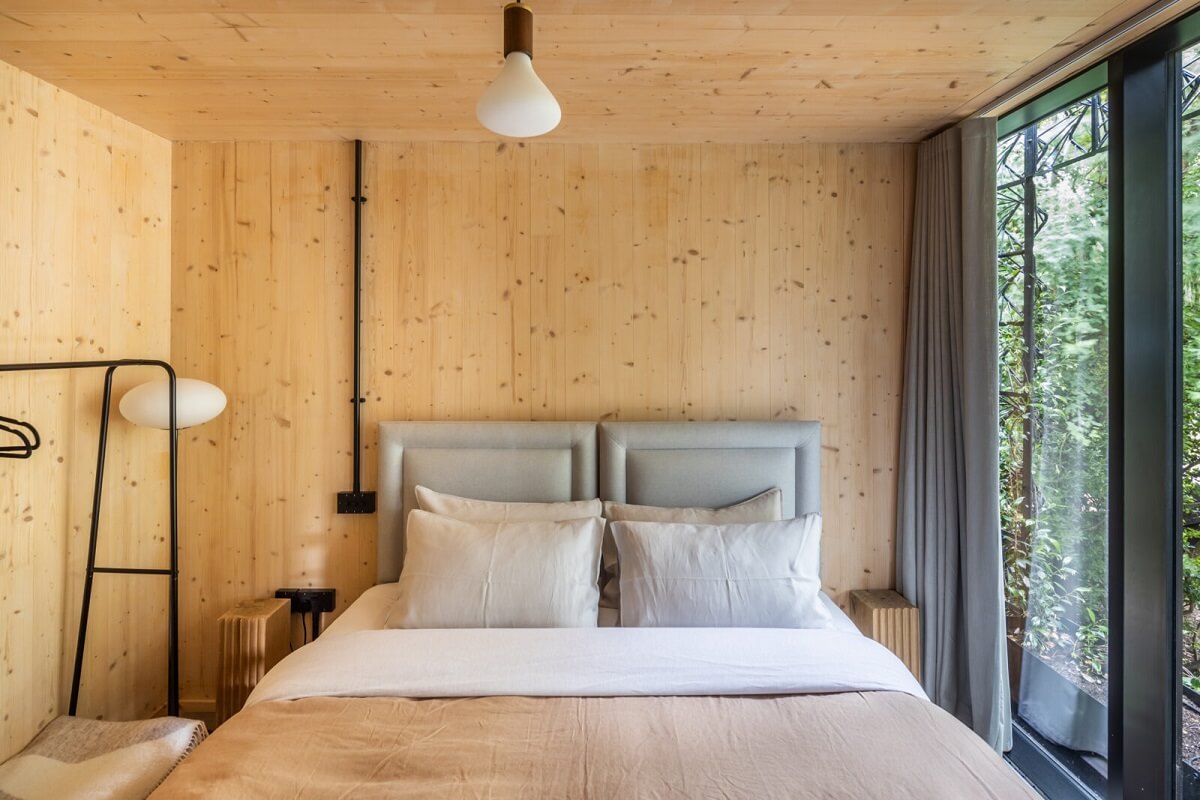 A Modern English Home with a Sculptural Facade 17 bedroom-wooden-walls-nordroom